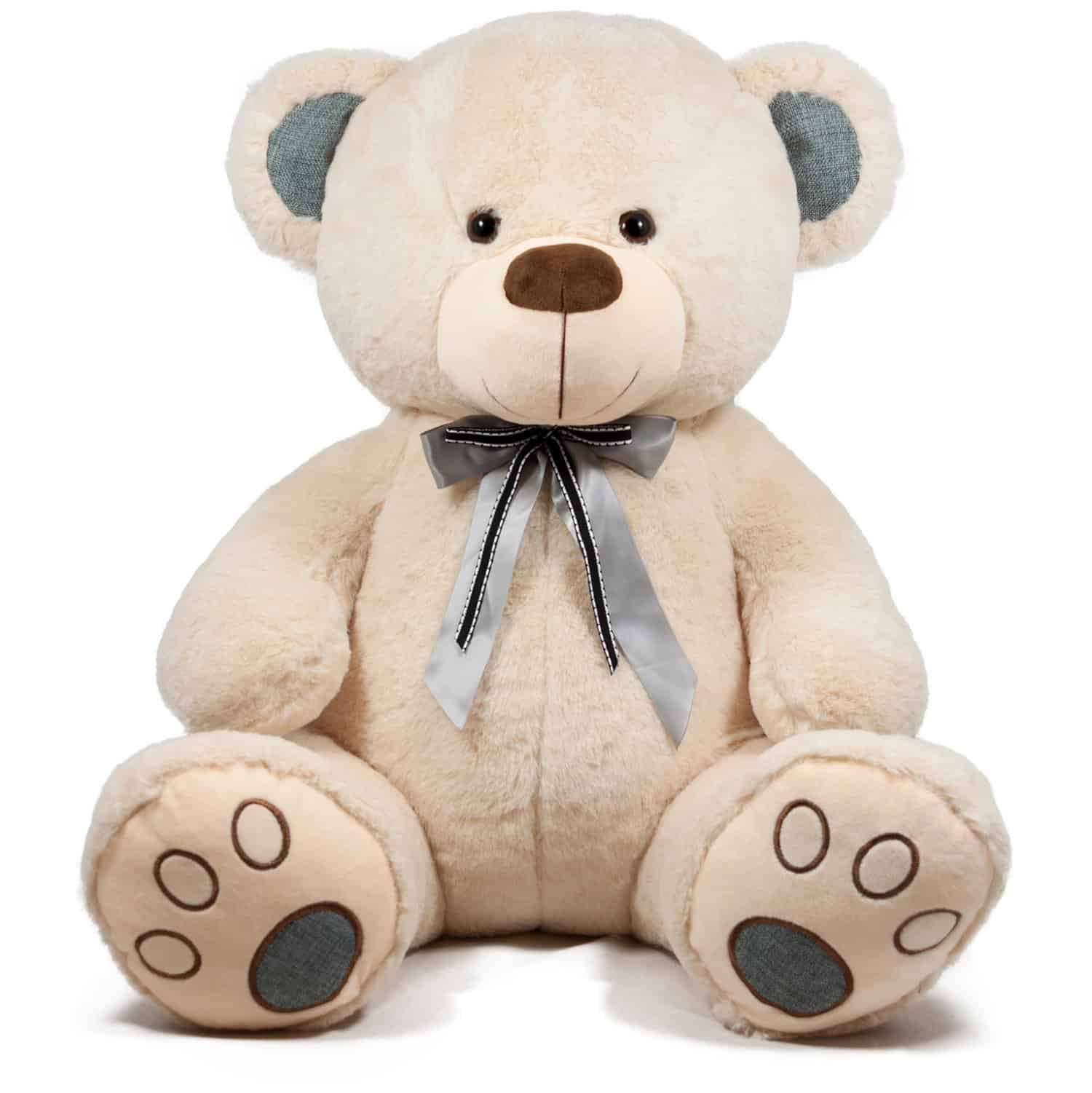 меко плюшено мече с сива панделка около врата, подходящо за подарък или украса за детска парти, сладка декорация и уютна играчка за деца и възрастни.